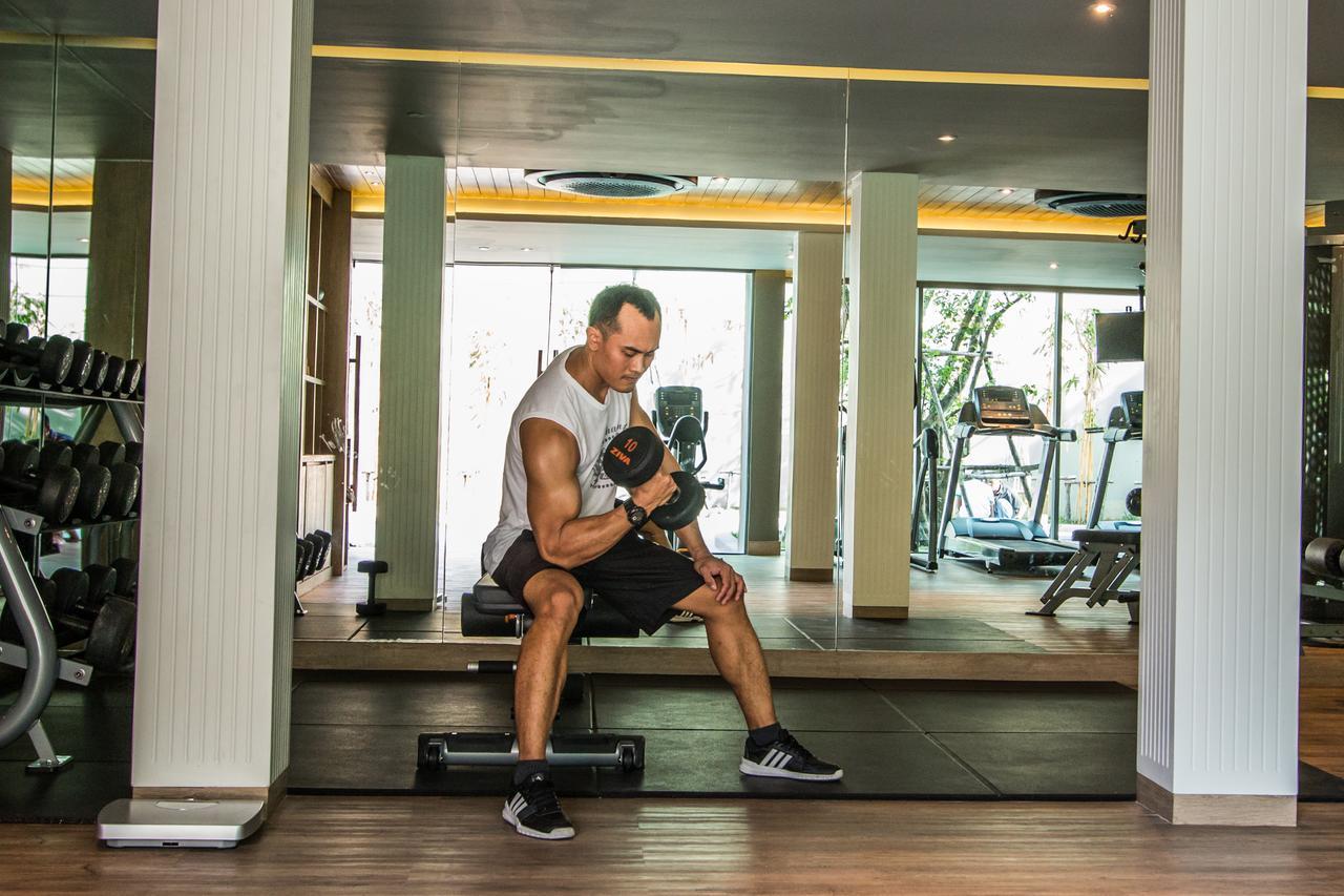Fusion Suites Phuket Patong Экстерьер фото A man lifting weights