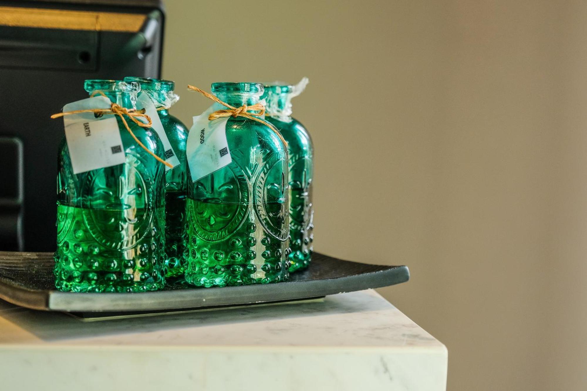 Fusion Suites Phuket Patong Экстерьер фото Bottles of absinthe
